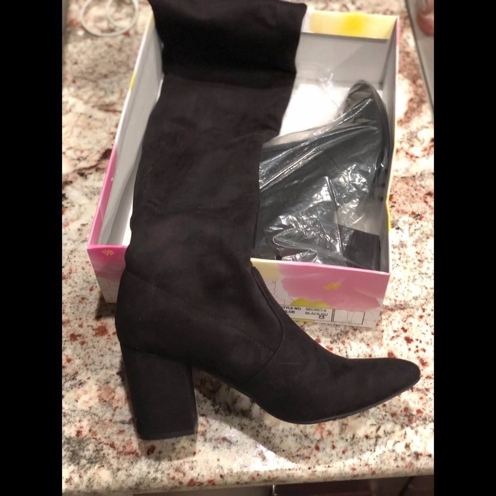 Thigh high black boots